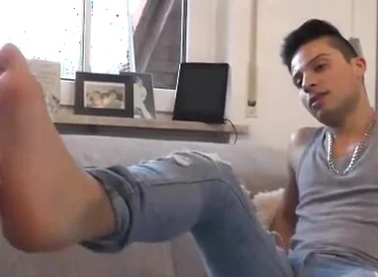 Young alpha feet licking