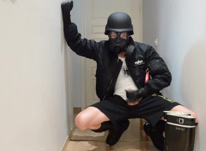 Gas masked guy cums on his rubber boots