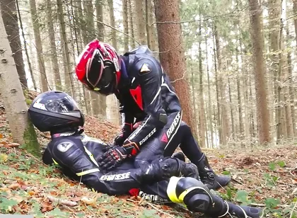 German dainese bikers having fun in the wood