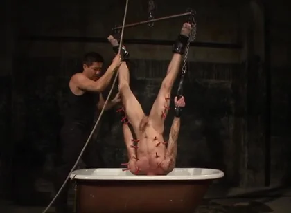 Tryp Hangs Inverted Over A Tub Of Cold Water